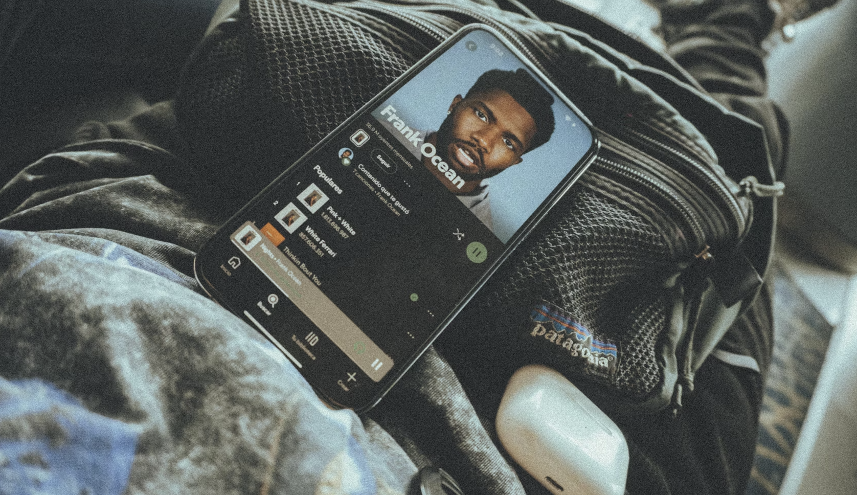 A plain orange background fills the image.