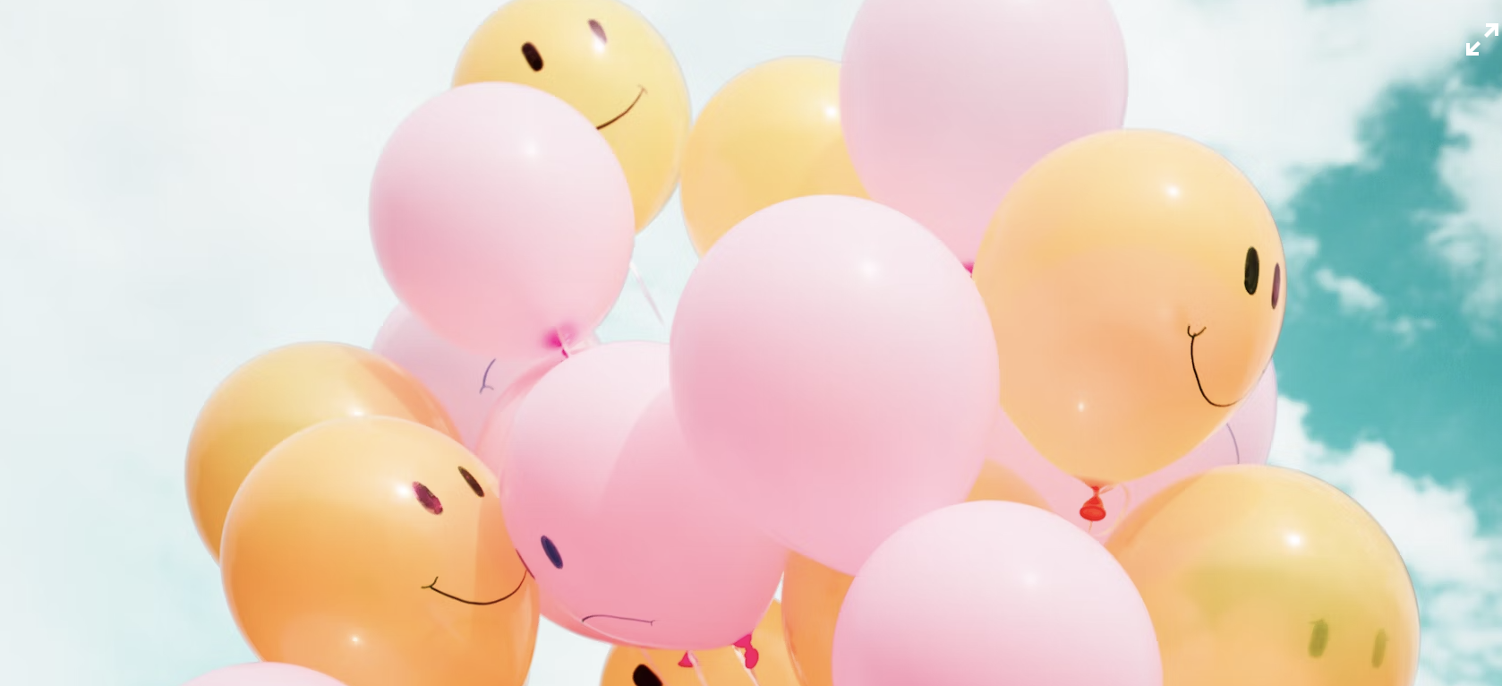 A joyful person smiling brightly, embodying the happiness of smile quotes.