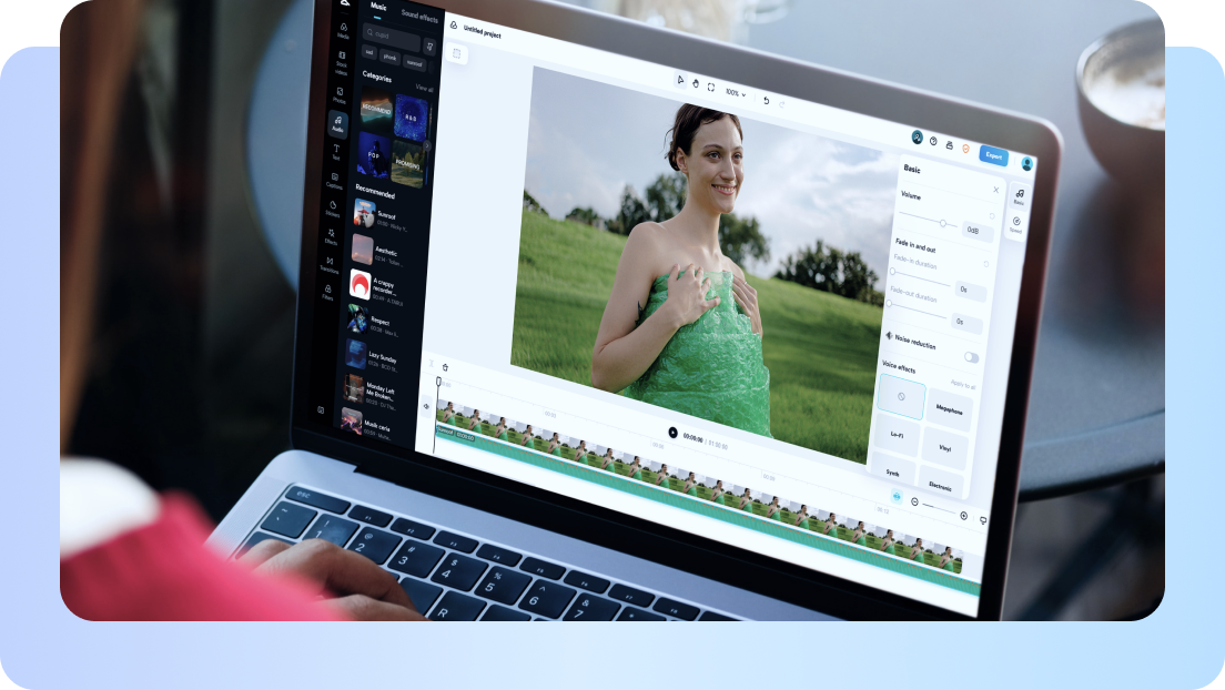 A woman's video preview and a populated timeline are visible on the editor displayed by a laptop