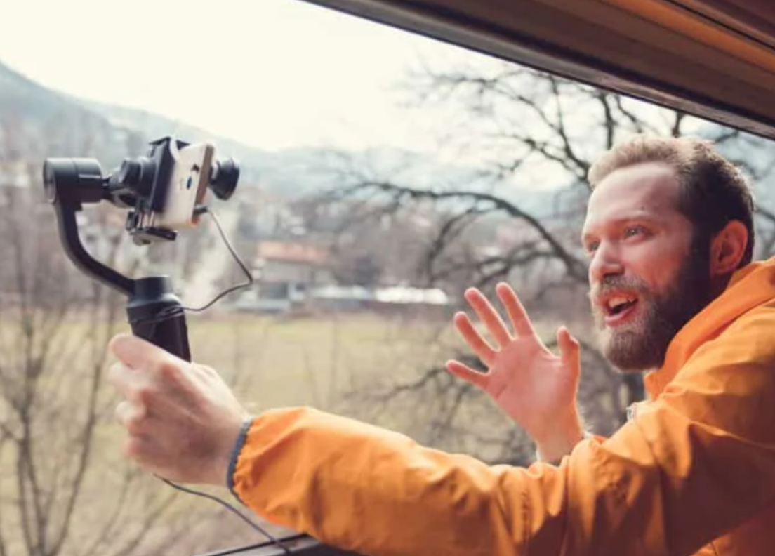 Travel vlogger filming scenic views with drone footage