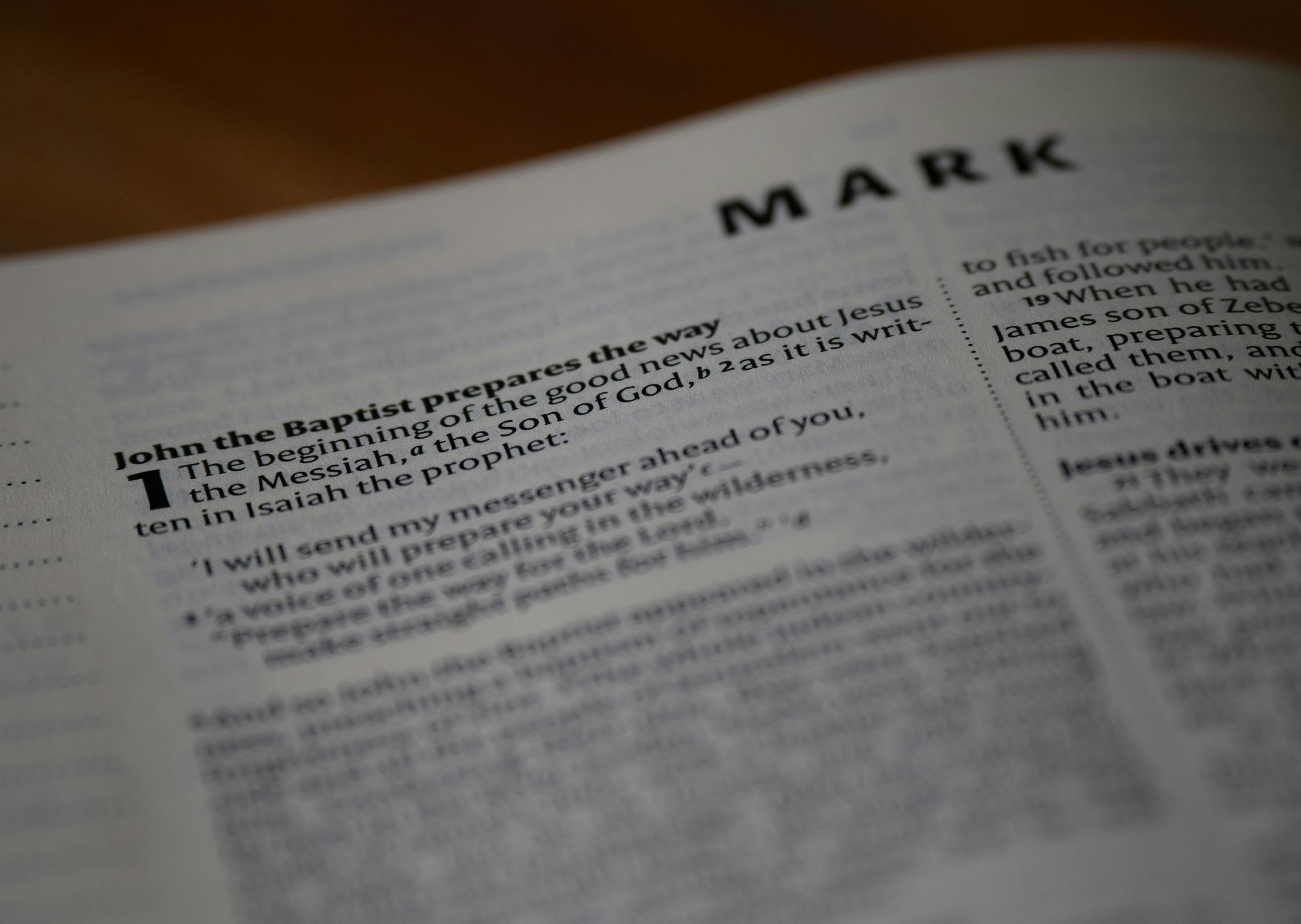 Remove the “MARK” text from the top of the book
